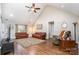 Spacious living room with hardwood floors, vaulted ceilings, and leather sofas at 473 Griggs Rd, Clover, SC 29710