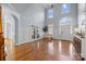 Two-story foyer with hardwood floors, neutral walls, and natural light at 9442 Titus Ln, Huntersville, NC 28078