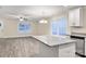 Open concept kitchen with island, granite countertops, and stainless steel appliances at 1026 Hill St, Albemarle, NC 28001