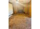 Living room featuring a brick fireplace and wood paneling at 116 Lodge Hall Ct, Stony Point, NC 28678