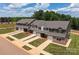 Aerial view of townhomes showcasing the community layout and landscaping at 5156 Tommy Ln # 1301, Stanley, NC 28164