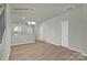 Bright dining area with hardwood floors, open to kitchen and stairs at 5156 Tommy Ln # 1301, Stanley, NC 28164