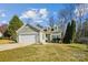 Two-story house with attached garage and landscaped lawn at 109 Golden Rain Ct, Mount Holly, NC 28120