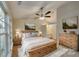 Main bedroom with wood bed frame and ensuite bathroom at 1239 Kerry Greens Dr, Matthews, NC 28104