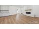Finished basement with fireplace, built-in shelving, and hardwood floors at 148 Windy Dell Dr, Tega Cay, SC 29708