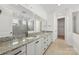 Elegant bathroom with granite double vanity and large walk-in shower at 148 Windy Dell Dr, Tega Cay, SC 29708