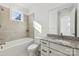 Bathroom with beige tile, granite countertop, and single sink vanity at 148 Windy Dell Dr, Tega Cay, SC 29708