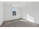 Bright bedroom with neutral carpeting and large window at 148 Windy Dell Dr, Tega Cay, SC 29708