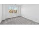 Bright bedroom with grey carpet and a large window at 148 Windy Dell Dr, Tega Cay, SC 29708