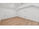 Spacious bonus room with hardwood floors and sloped ceilings at 148 Windy Dell Dr, Tega Cay, SC 29708