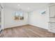 Light-filled breakfast area with hardwood floors and sliding glass door access to patio at 148 Windy Dell Dr, Tega Cay, SC 29708