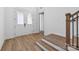 Bright entryway with double doors, hardwood floors, and staircase at 148 Windy Dell Dr, Tega Cay, SC 29708