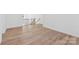 Bright hallway with wood-look floors and access to upper level at 148 Windy Dell Dr, Tega Cay, SC 29708