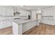 Bright kitchen with an island, granite countertops, and stainless steel appliances at 148 Windy Dell Dr, Tega Cay, SC 29708
