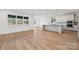 Spacious kitchen with white cabinets, granite countertops, and hardwood floors at 148 Windy Dell Dr, Tega Cay, SC 29708