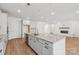 Modern kitchen with a large island, granite countertops, and stainless steel appliances at 148 Windy Dell Dr, Tega Cay, SC 29708
