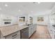 Open kitchen with granite island, stainless steel dishwasher, and hardwood floors at 148 Windy Dell Dr, Tega Cay, SC 29708