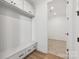 Laundry room with built-in bench, drawers, and additional storage at 148 Windy Dell Dr, Tega Cay, SC 29708