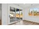 Spacious home office featuring hardwood floors and sliding glass doors at 148 Windy Dell Dr, Tega Cay, SC 29708