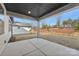Covered patio overlooking the backyard and neighborhood at 148 Windy Dell Dr, Tega Cay, SC 29708