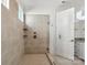 Spa-like shower with neutral tile and a glass enclosure at 148 Windy Dell Dr, Tega Cay, SC 29708