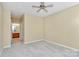 Condo bedroom with ceiling fan and neutral walls at 16316 Redstone Mountain Ln, Charlotte, NC 28277