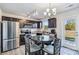 Modern kitchen with dark brown cabinets, granite countertops, and stainless steel appliances at 213 Morton St, Shelby, NC 28152