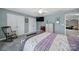 Spacious bedroom with double doors and a ceiling fan at 2481 Bergamot St, Tega Cay, SC 29708