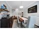 Bright dining area with hardwood floors and built-in buffet at 2481 Bergamot St, Tega Cay, SC 29708