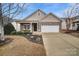 Attractive ranch-style home with a landscaped front yard at 2481 Bergamot St, Tega Cay, SC 29708