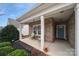 Inviting front porch with seating and landscaping at 2481 Bergamot St, Tega Cay, SC 29708