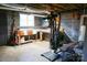 Unfinished basement workshop with workbench and exercise equipment at 2514 Pinoak Dr, Hickory, NC 28602