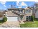 Brick two-story house with a white two-car garage and landscaped lawn at 3032 Sterling Ct, Indian Land, SC 29707