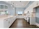 Modern clubhouse kitchen with white cabinets and quartz countertops at 3233 Whispering Creek Dr # 091, Indian Trail, NC 28079