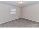 Well-lit bedroom with neutral walls and carpet at 3416 Olde Creek Trl, Matthews, NC 28105