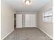 Spacious bedroom with neutral walls, carpet and double doors at 3416 Olde Creek Trl, Matthews, NC 28105