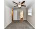 Bedroom with ceiling fan and access to bathroom at 3416 Olde Creek Trl, Matthews, NC 28105