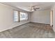 Spacious living room with neutral walls, carpet flooring, and a ceiling fan at 3416 Olde Creek Trl, Matthews, NC 28105