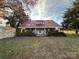 Ranch home with red metal roof and detached shed at 3599 Zion Church Rd, Hickory, NC 28602