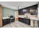 Modern kitchen with dark cabinetry and stainless steel appliances at 3612 The Plz, Charlotte, NC 28205