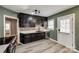 Modern kitchen with dark cabinetry and stainless steel appliances at 3612 The Plz, Charlotte, NC 28205