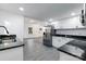 Bright kitchen features stainless steel refrigerator and granite countertops at 404 Morton St, Shelby, NC 28152