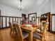 Formal dining room with hardwood floors and adjacent living room at 407 N Grove St, Lincolnton, NC 28092