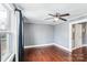 Simple bedroom with hardwood floors and neutral walls at 415 Willow St, Gastonia, NC 28054