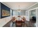 Bright dining room features a wood table, chandelier, and dark blue accent wall at 415 Willow St, Gastonia, NC 28054