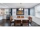 Elegant dining room with hardwood floors and a modern chandelier at 415 S Willow St, Gastonia, NC 28034