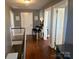 Upper hallway with hardwood floors and neutral walls at 415 Willow St, Gastonia, NC 28054