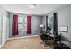 Home office with a desk, chair, and burgundy curtains at 415 Willow St, Gastonia, NC 28054