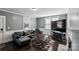 Living Room with hardwood floors, a fireplace, and ample natural light at 415 Willow St, Gastonia, NC 28054
