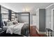 Main bedroom with four-poster bed, hardwood floors, and gray walls at 415 Willow St, Gastonia, NC 28054